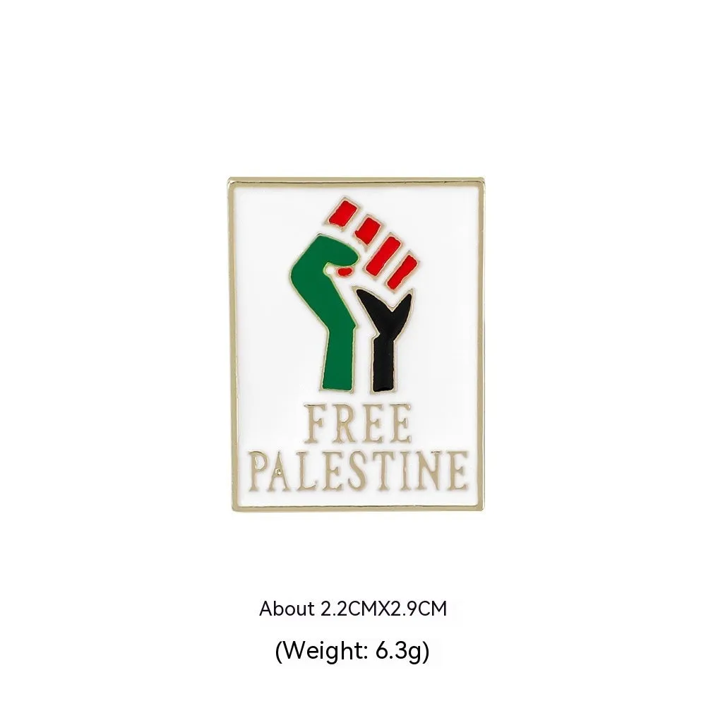 Square corrugated alloy brooch with Palestinian flag design on a neutral background
