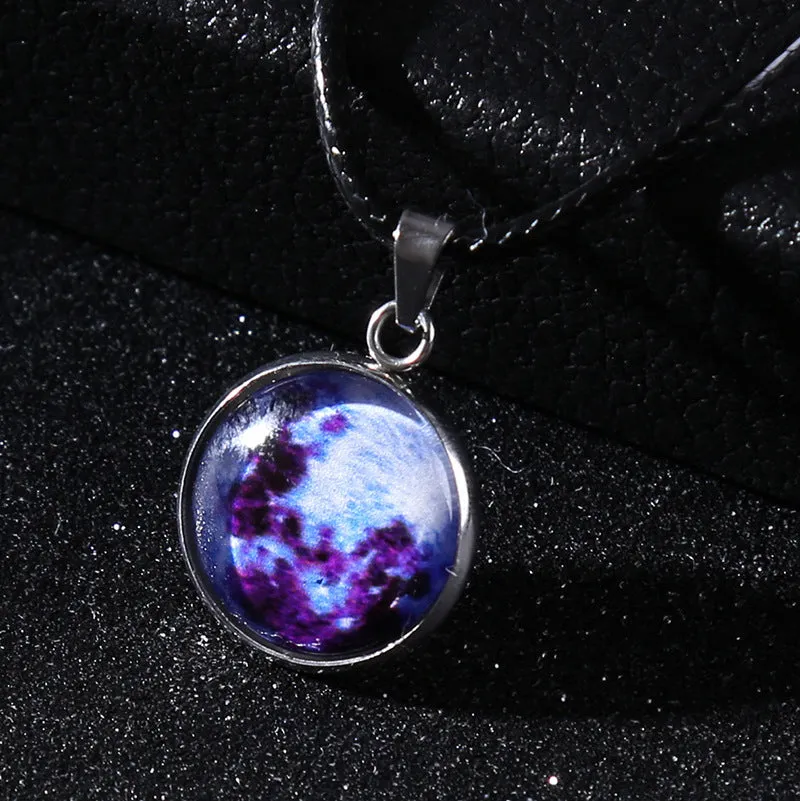 Luminous alloy necklace with a constellation-modelled glass pendant on an adjustable chain.