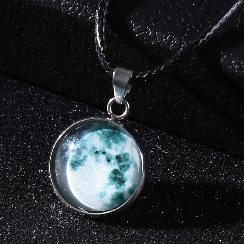 Luminous alloy necklace with a constellation-modelled glass pendant on an adjustable chain.