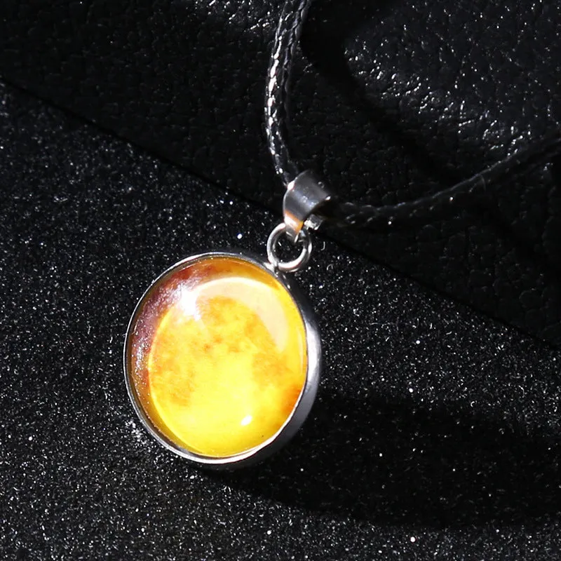 Luminous alloy necklace with a constellation-modelled glass pendant on an adjustable chain.