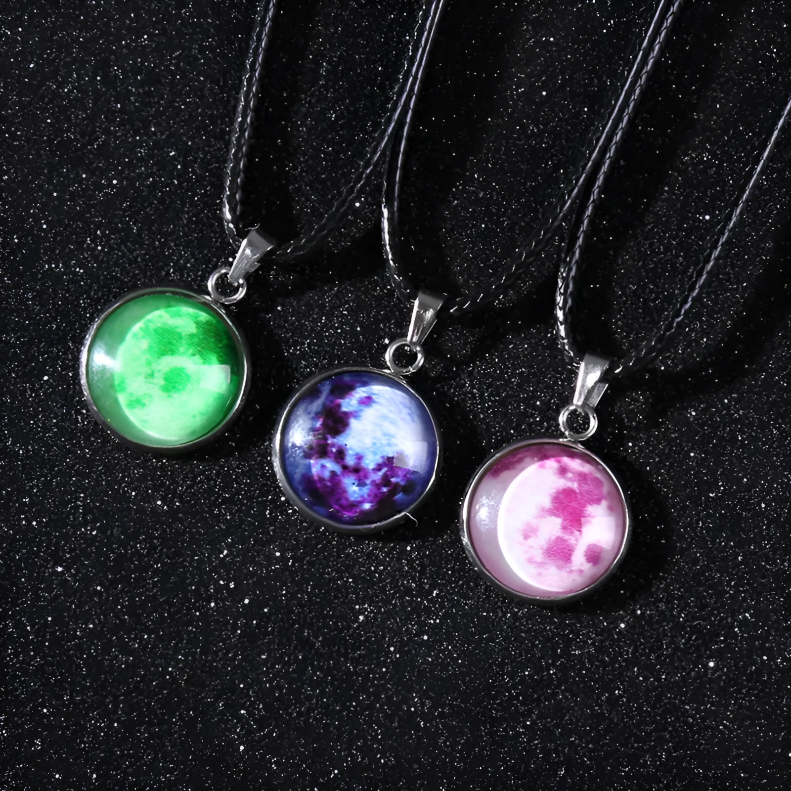 Luminous alloy necklace with a constellation-modelled glass pendant on an adjustable chain.