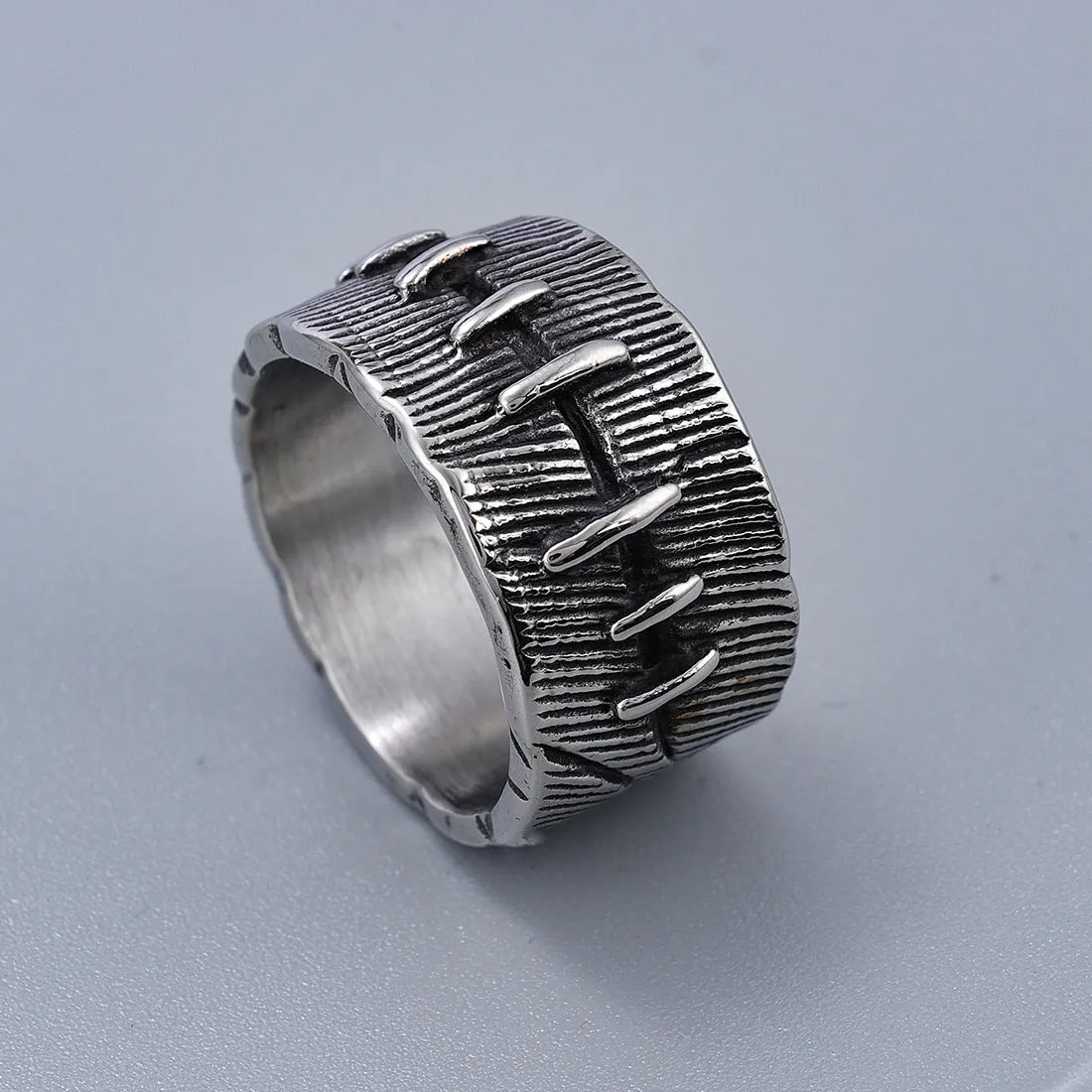 Geometric titanium steel dark punk double ring in a U-shape, shown in a retro colour.