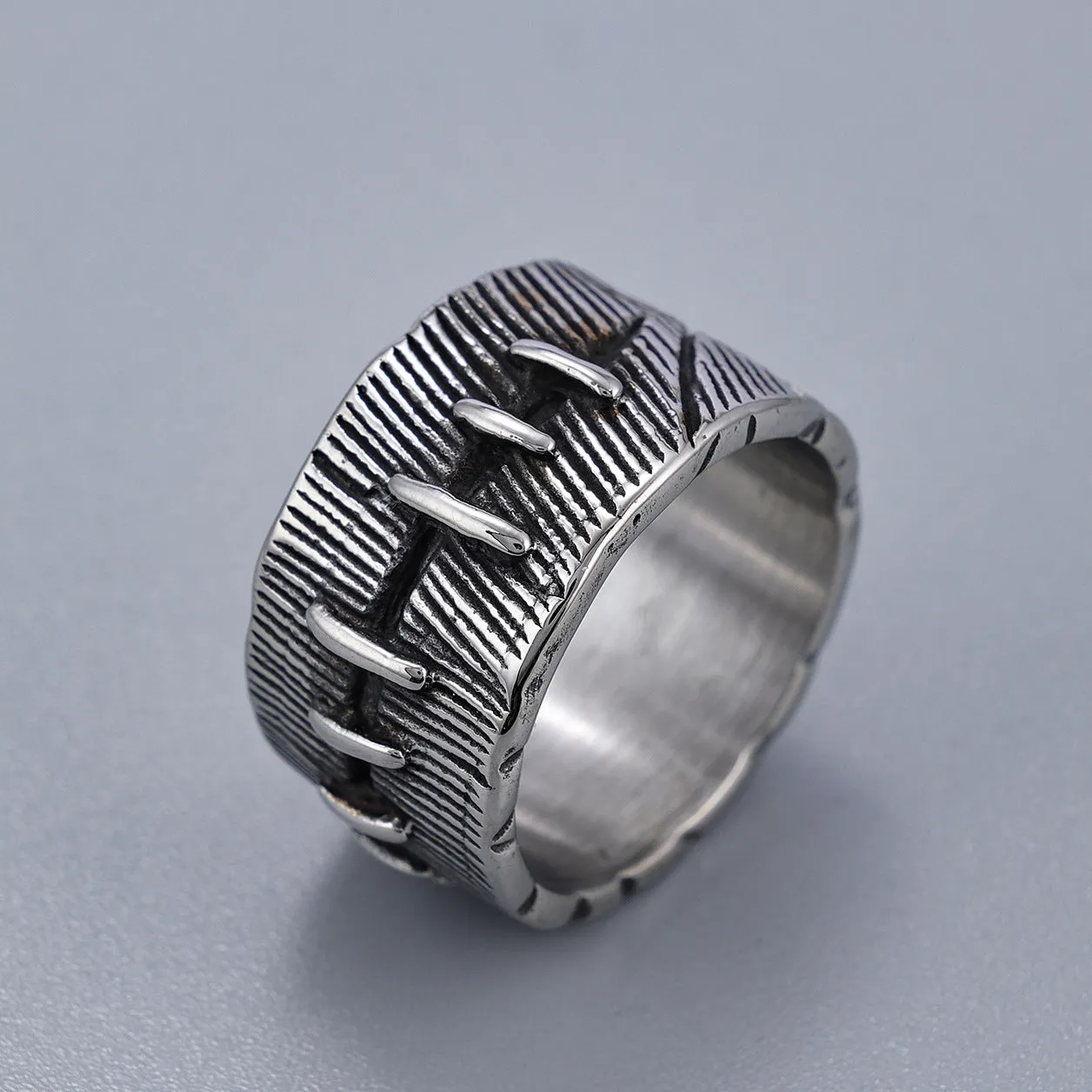 Geometric titanium steel dark punk double ring in a U-shape, shown in a retro colour.