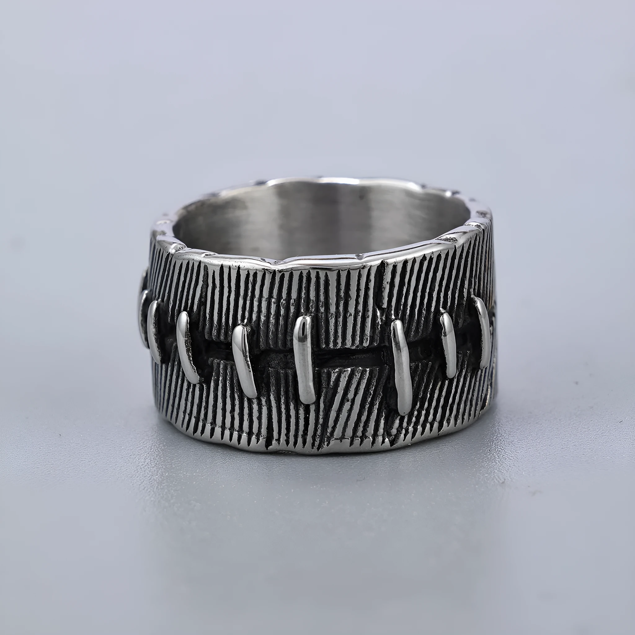 Geometric titanium steel dark punk double ring in a U-shape, shown in a retro colour.