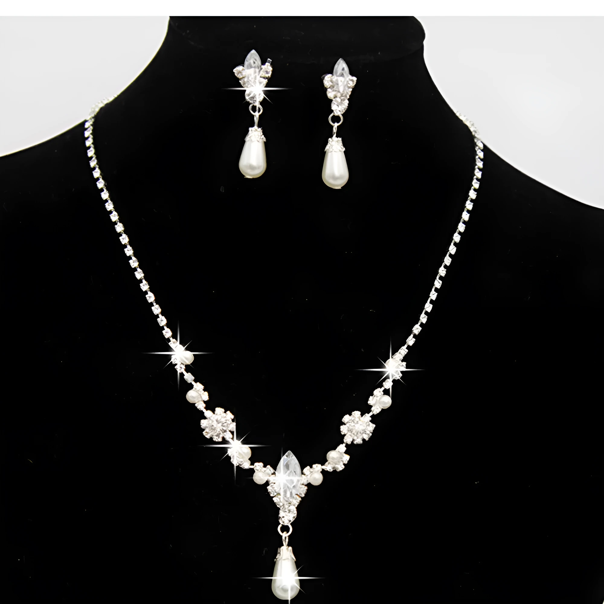 Drop pearl necklace and earrings set in white, blue, and pink for bridal and formal occasions