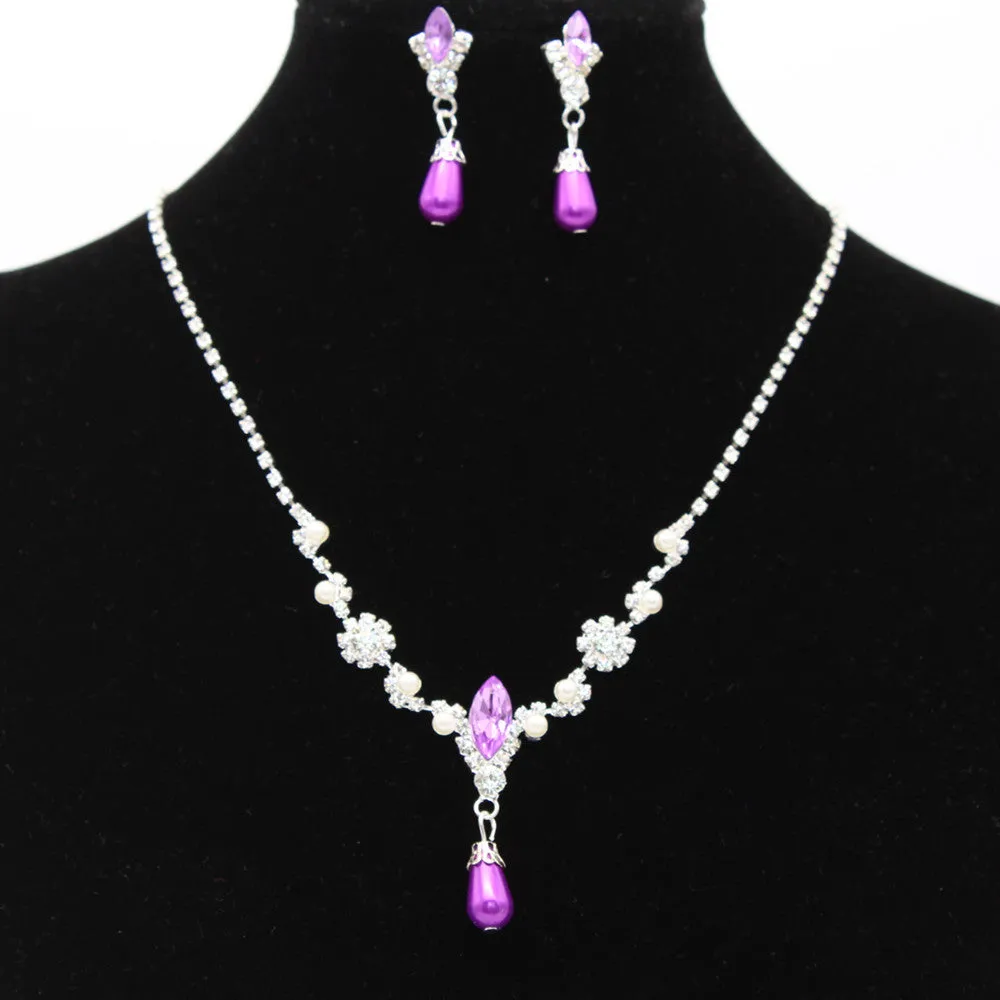 Drop pearl necklace and earrings set in white, blue, and pink for bridal and formal occasions