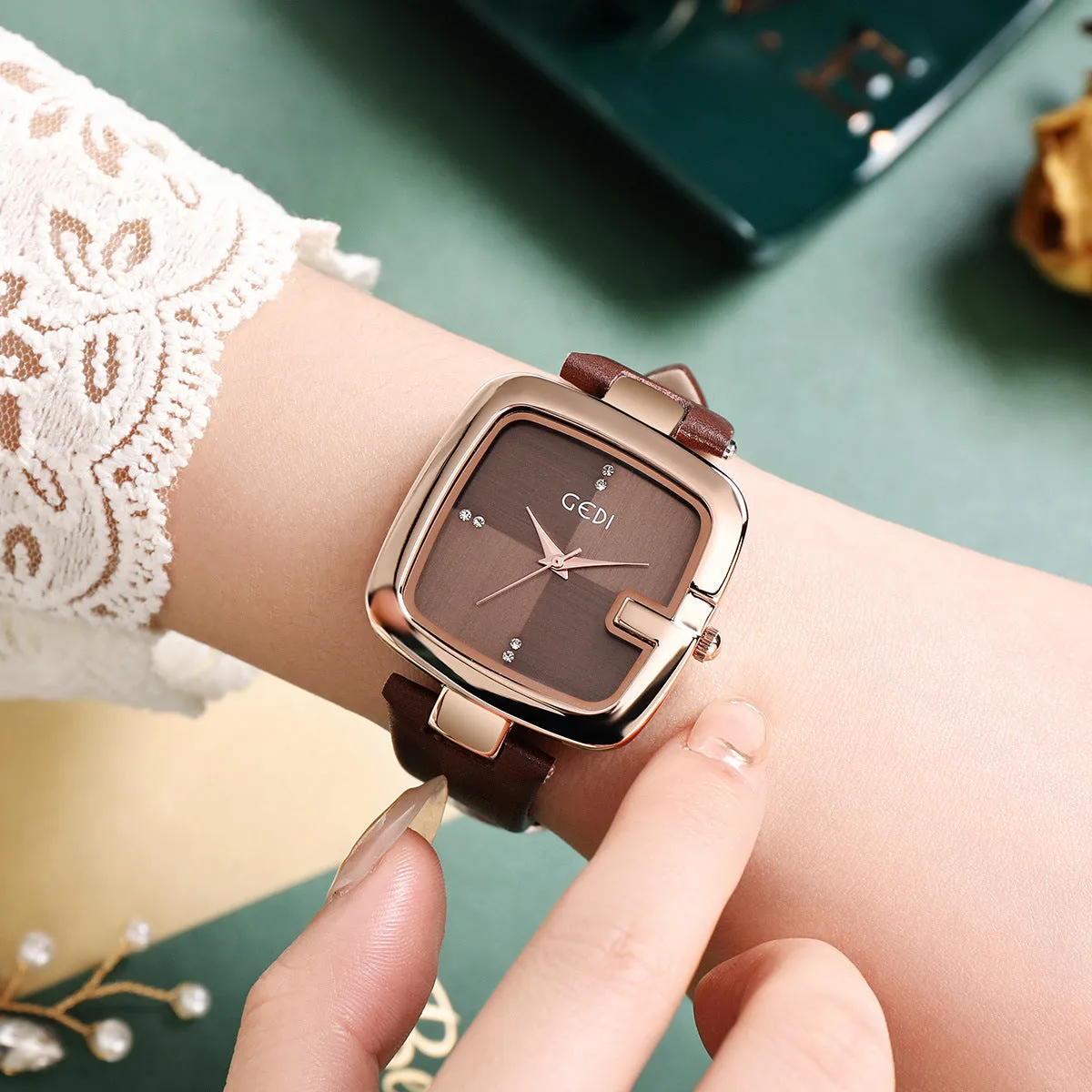 Women's quartz watch with leather strap in coffee colour showing 36mm dial and hardened glass