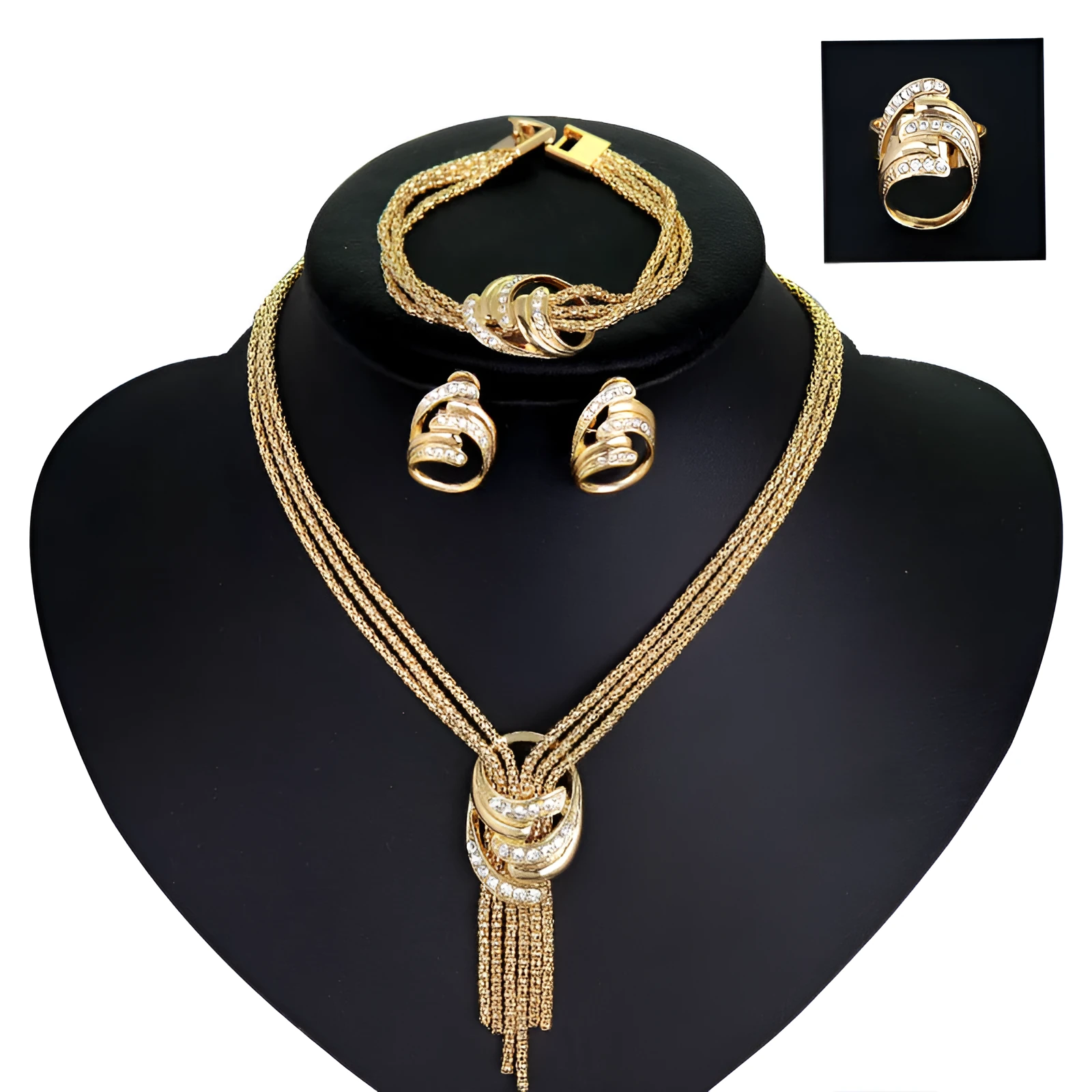 Gold alloy jewelry set with necklace, bracelet, earrings, and ring on a neutral background