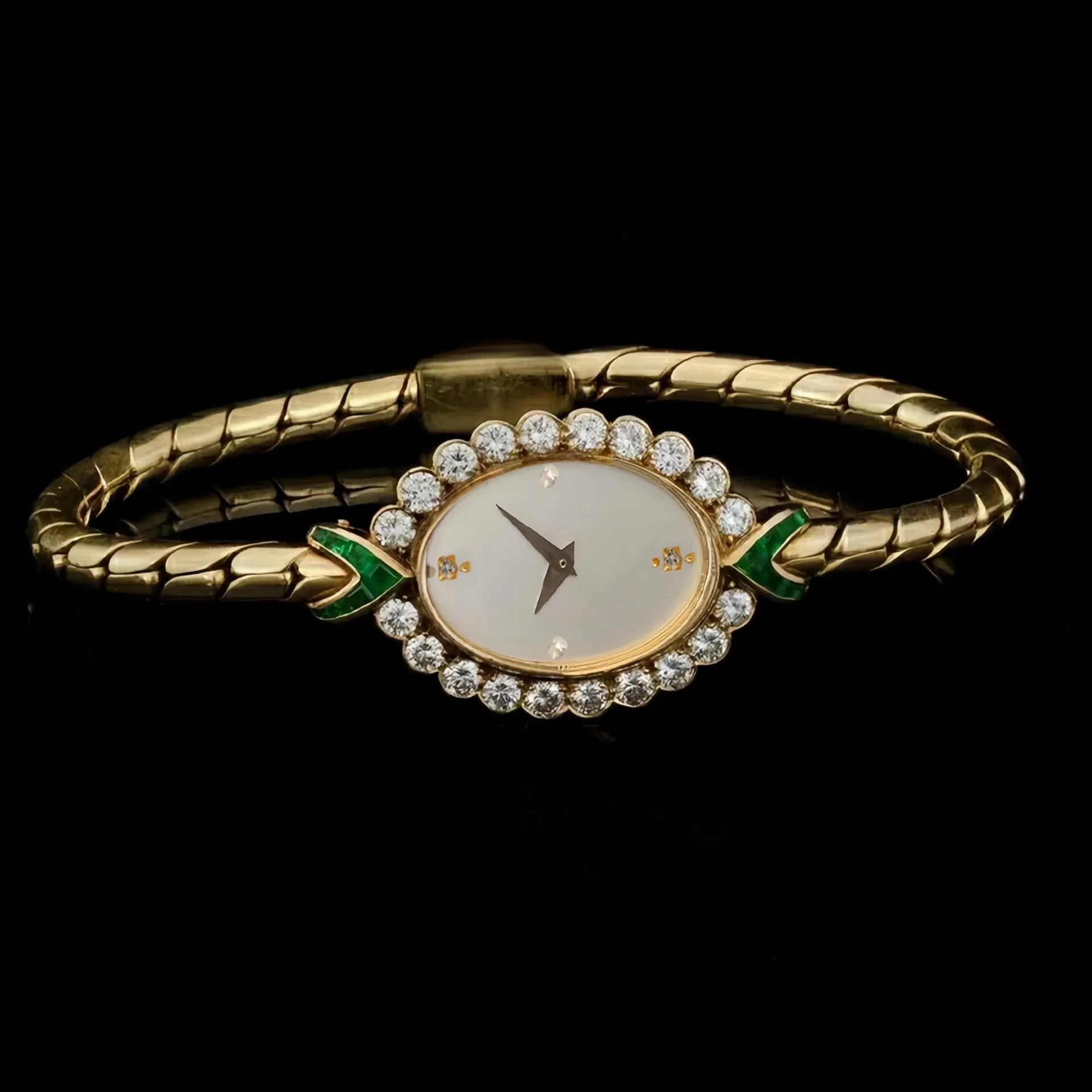 European small gold women's watch with handmade rhinestone inlay on a white background