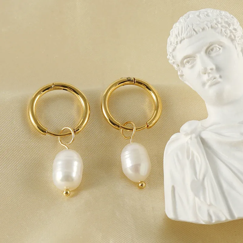 Gold geometric women's drop earrings with a pearl centre on hypoallergenic titanium steel posts.
