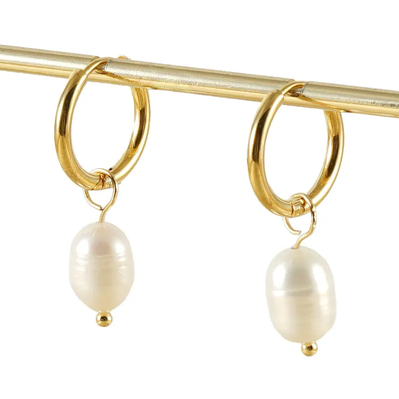 Gold geometric women's drop earrings with a pearl centre on hypoallergenic titanium steel posts.