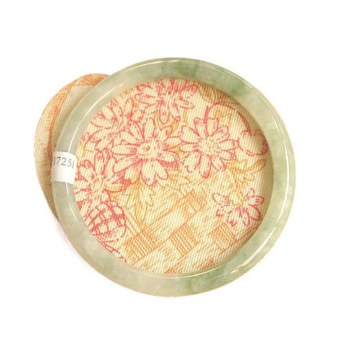 Traditional green jade waxy Chinese bracelet with geometric design showing 10mm profile