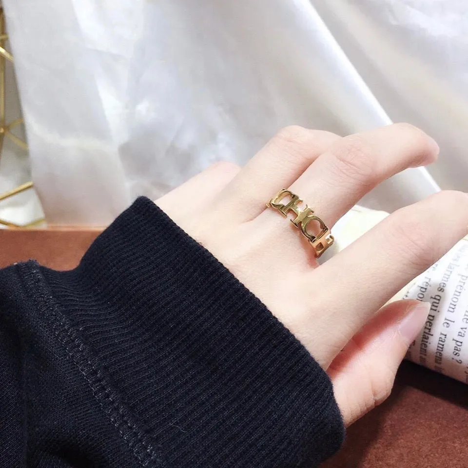 Gold titanium steel hollowed cut letter ring in unisex geometric Korean style, sizes 6-9