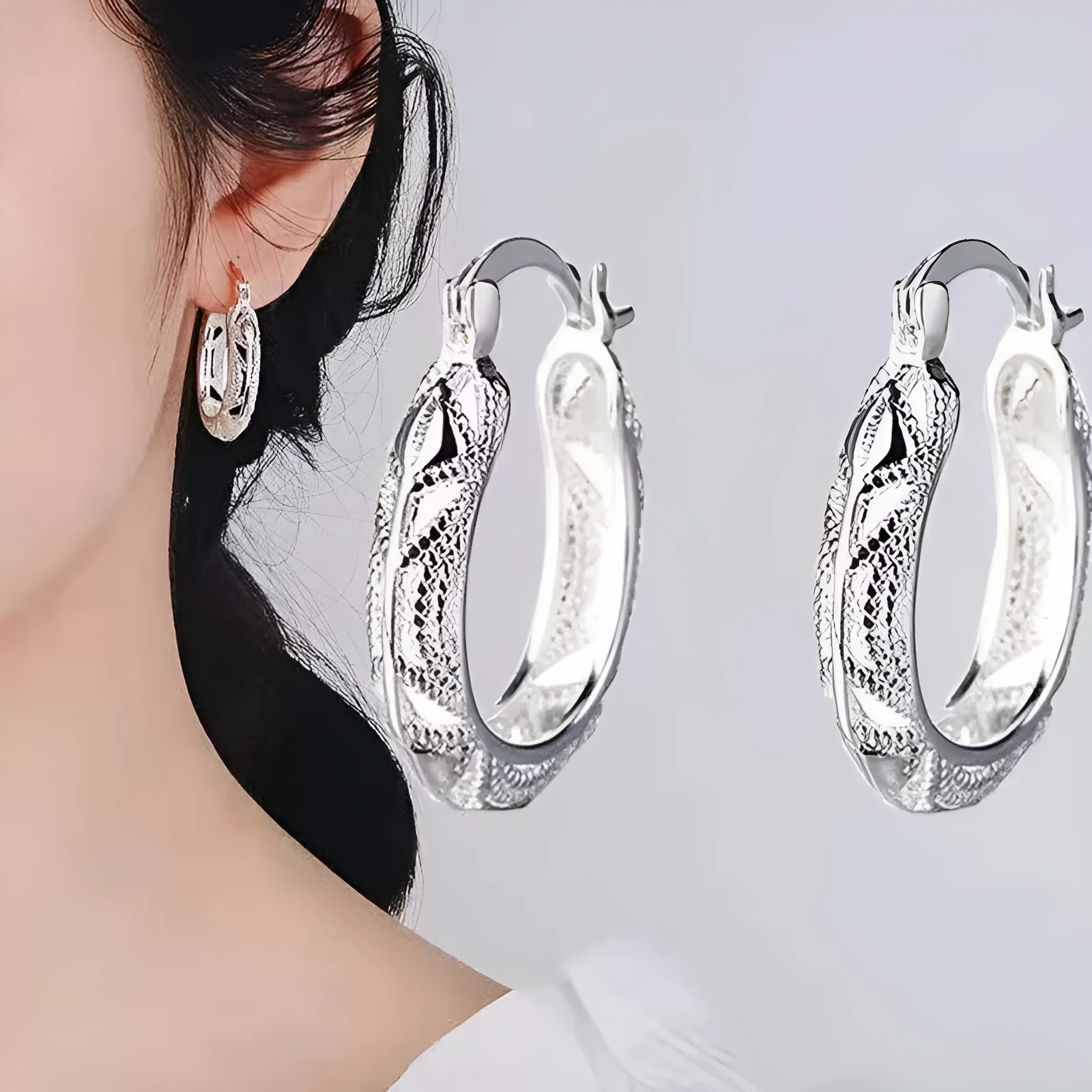 Geometric metal earrings for women with electroplated silver finish, individually packed.