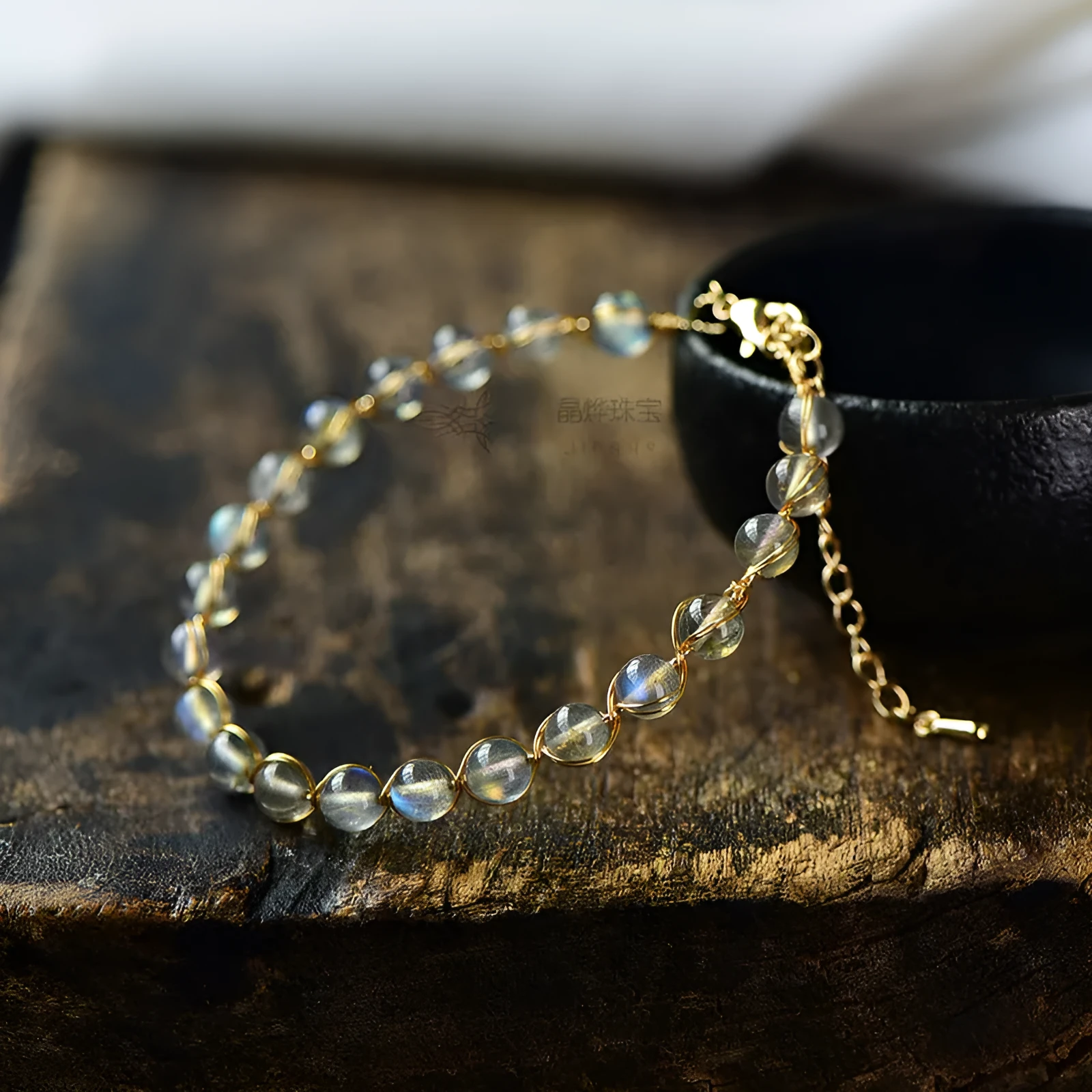 Blue moonstone bracelet with 14K gilded metal celestial design