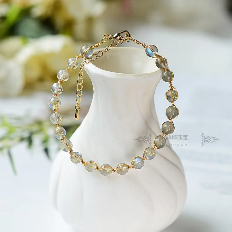 Blue moonstone bracelet with 14K gilded metal celestial design