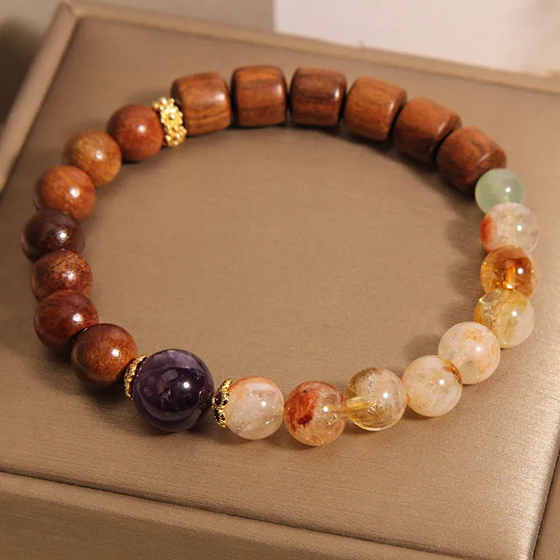 Women's bracelet in yellow tower crystal and amethyst tones with pearl and rhinestone decorative elements