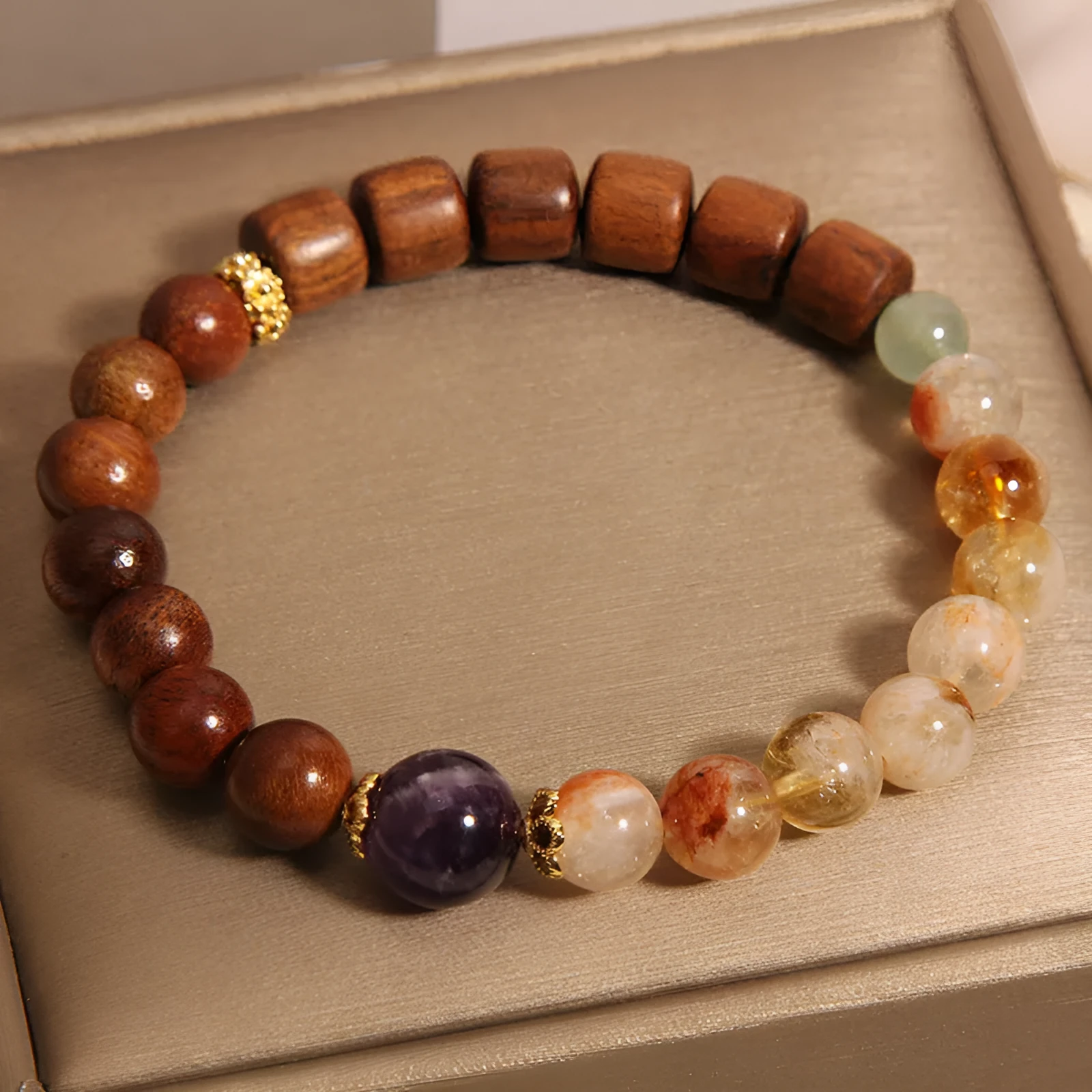 Women's bracelet in yellow tower crystal and amethyst tones with pearl and rhinestone decorative elements