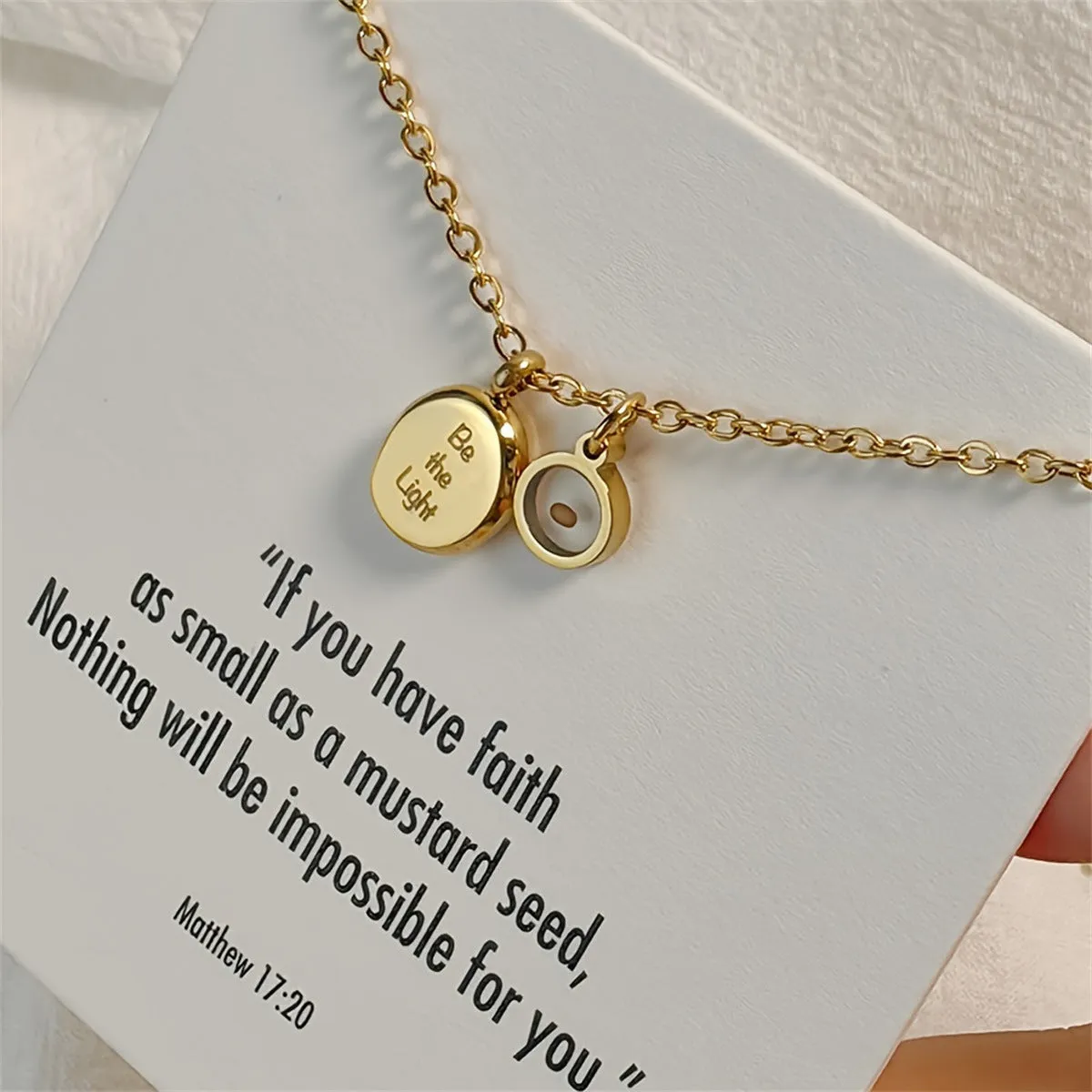 Stainless steel mustard seed faith pendant necklace on adjustable chain, silver colour, geometric shape with drip oil finish