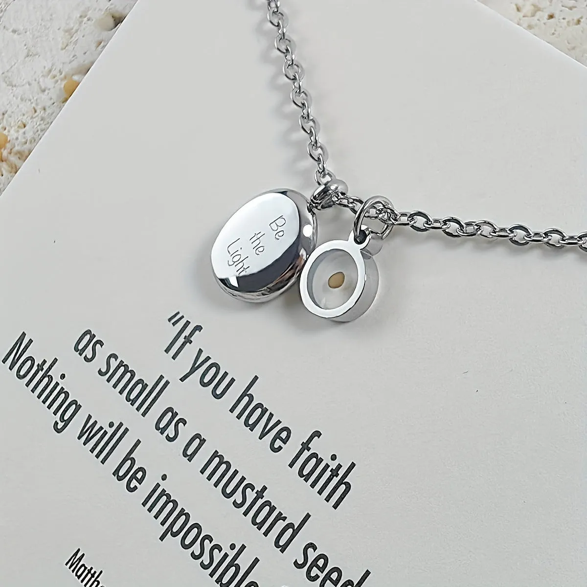 Stainless steel mustard seed faith pendant necklace on adjustable chain, silver colour, geometric shape with drip oil finish