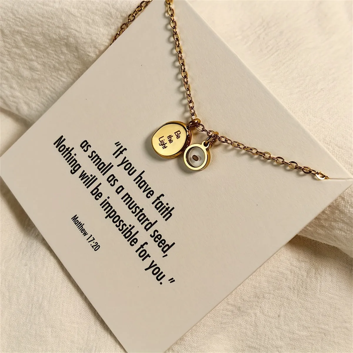 Stainless steel mustard seed faith pendant necklace on adjustable chain, silver colour, geometric shape with drip oil finish
