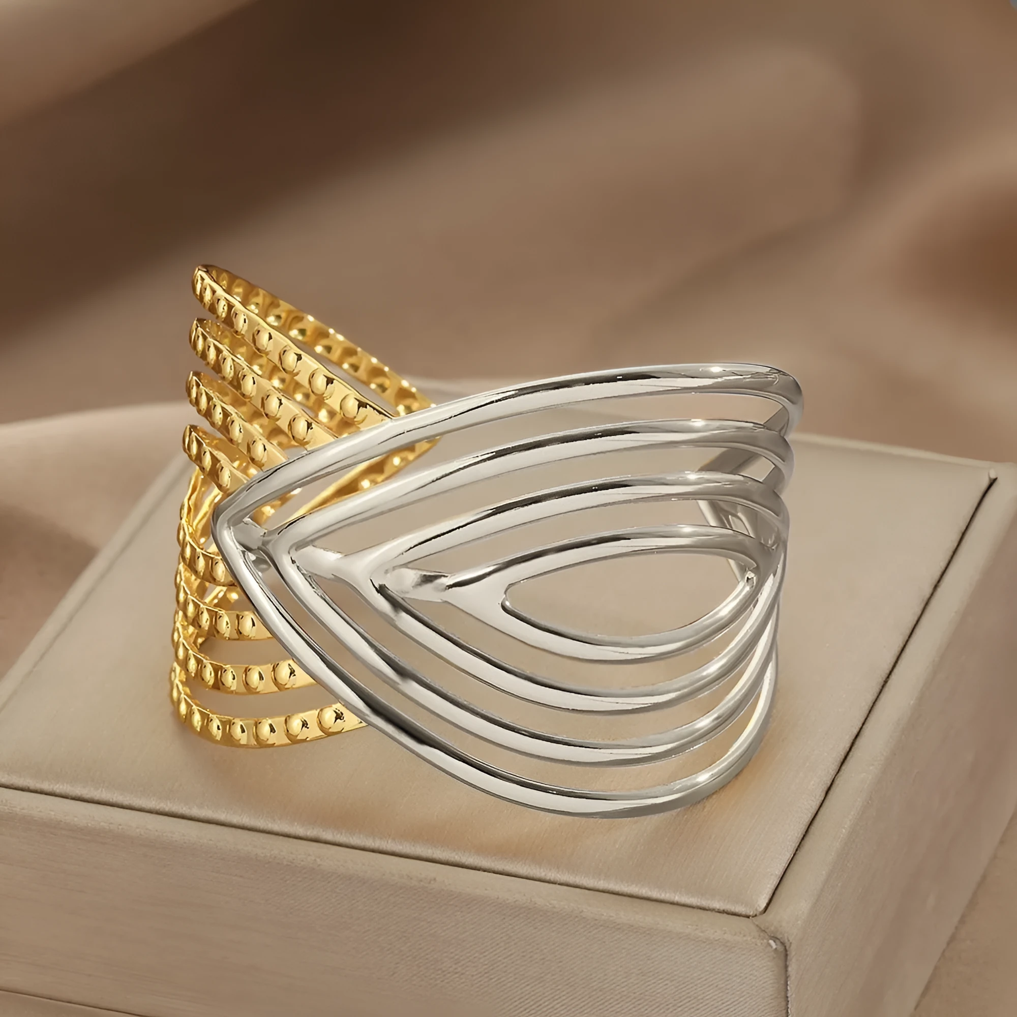 Stainless steel bracelet with lotus ring and glossy stripes, ellipse and line design, electroplated finish