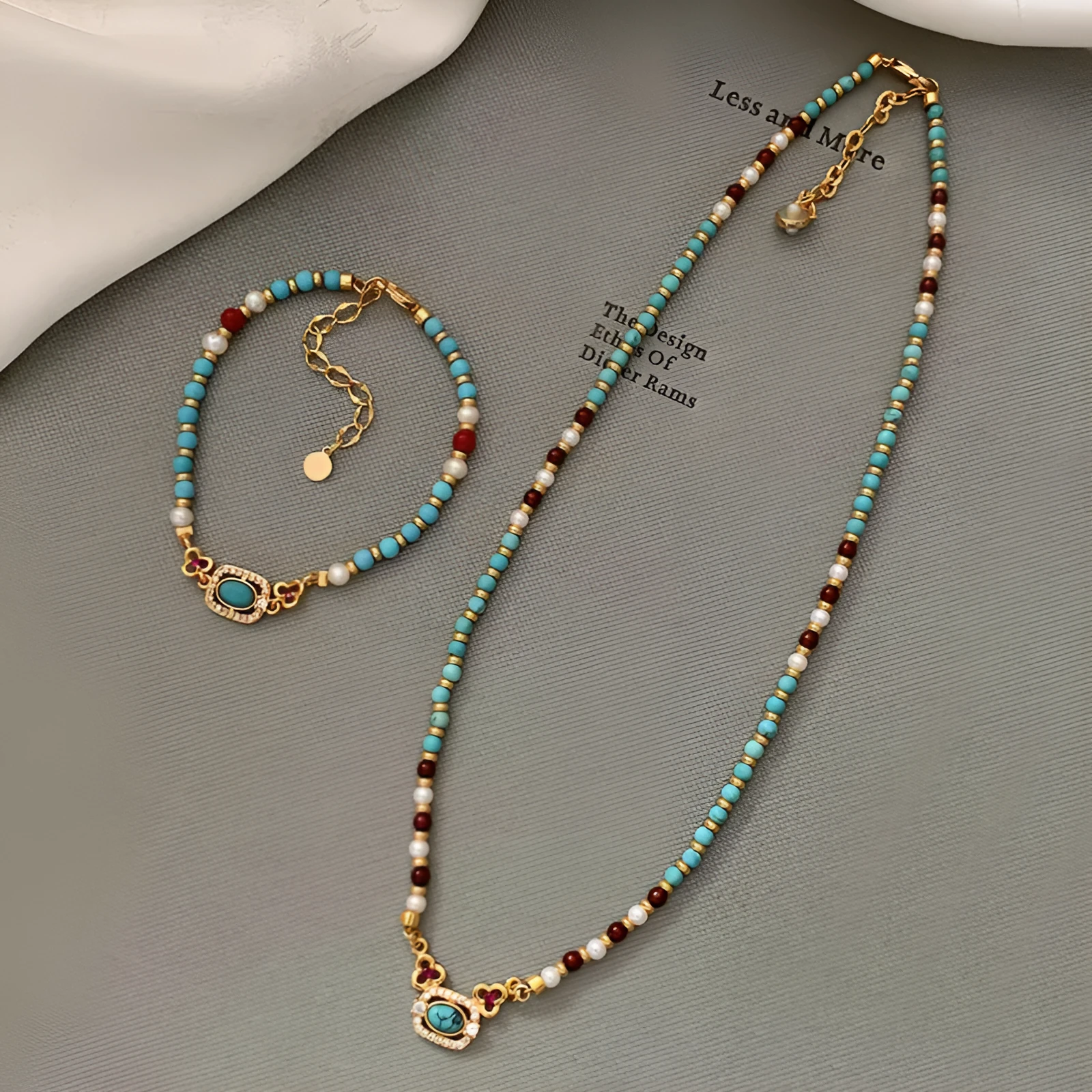 Natural turquoise pearl necklace with gold plated copper chain and matching bracelet on display
