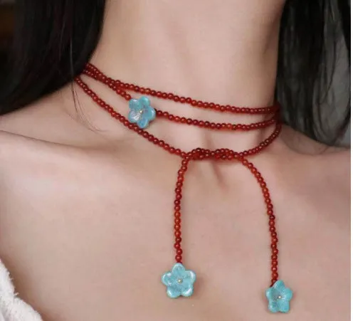 Red agate and acrylic geometric beaded necklace on a woman, adjustable chain 31-40cm