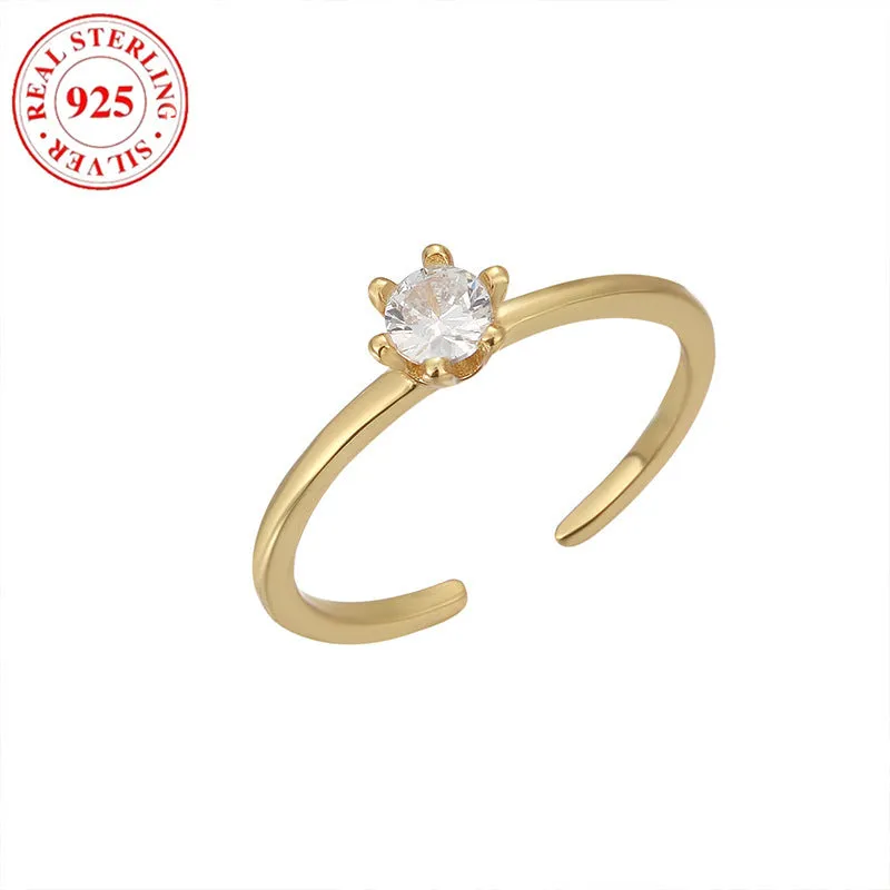S925 sterling silver adjustable toe ring with gold F048 finish and single zircon inlay on white background
