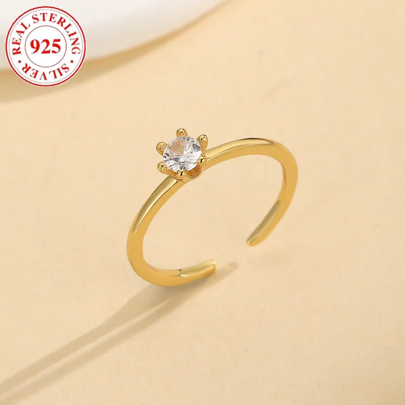 S925 sterling silver adjustable toe ring with gold F048 finish and single zircon inlay on white background