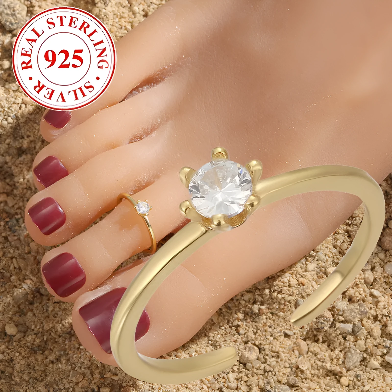 S925 sterling silver adjustable toe ring with gold F048 finish and single zircon inlay on white background
