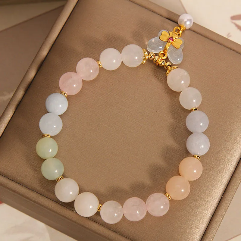 Women's crystal bracelet with butterfly pendant featuring natural morganite stones in candy colours