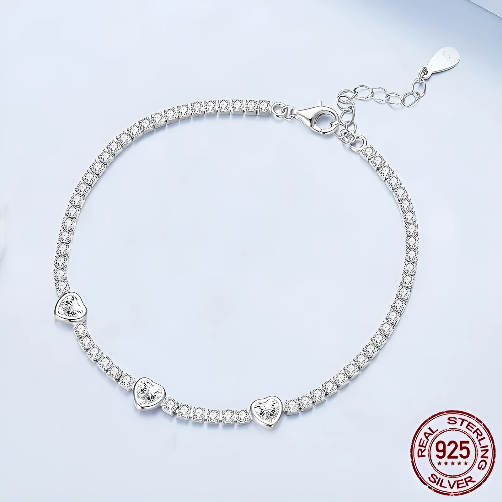 S925 sterling silver bracelet with heart-shaped clear zircon centrepiece on light background