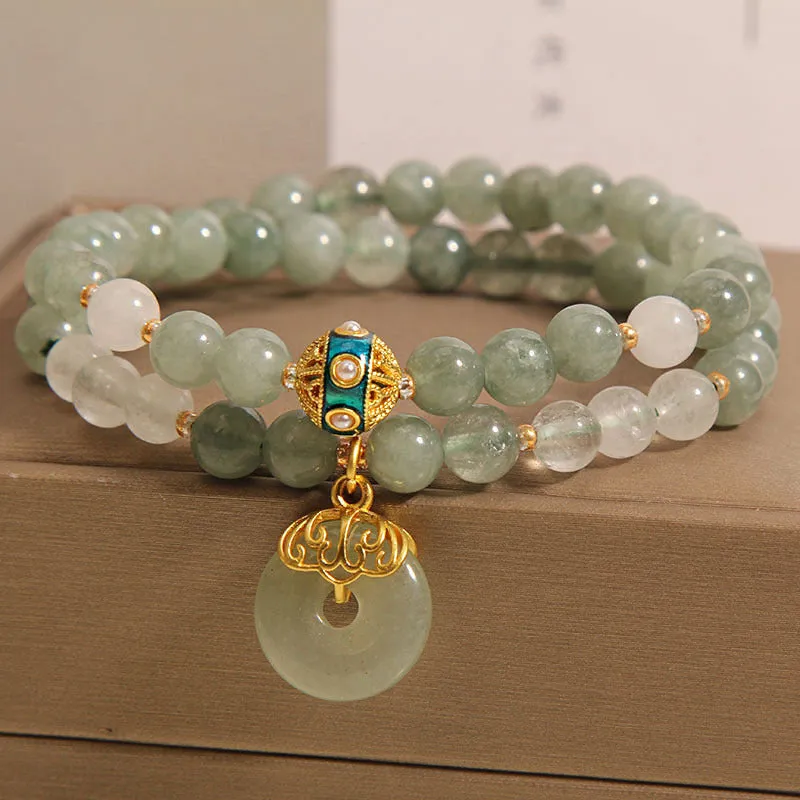 Women's double-layer crystal bracelet with peace buckle in oil emerald colour and rhinestone detailing