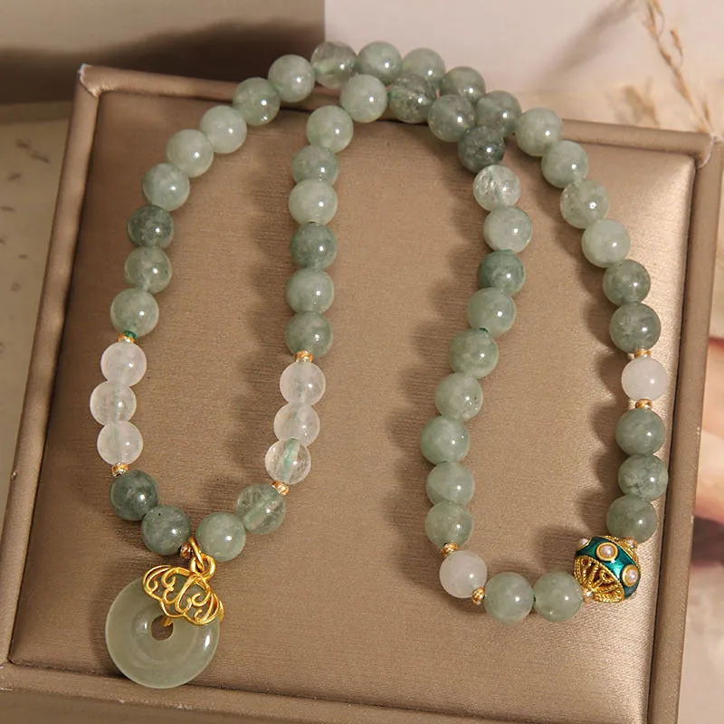 Women's double-layer crystal bracelet with peace buckle in oil emerald colour and rhinestone detailing