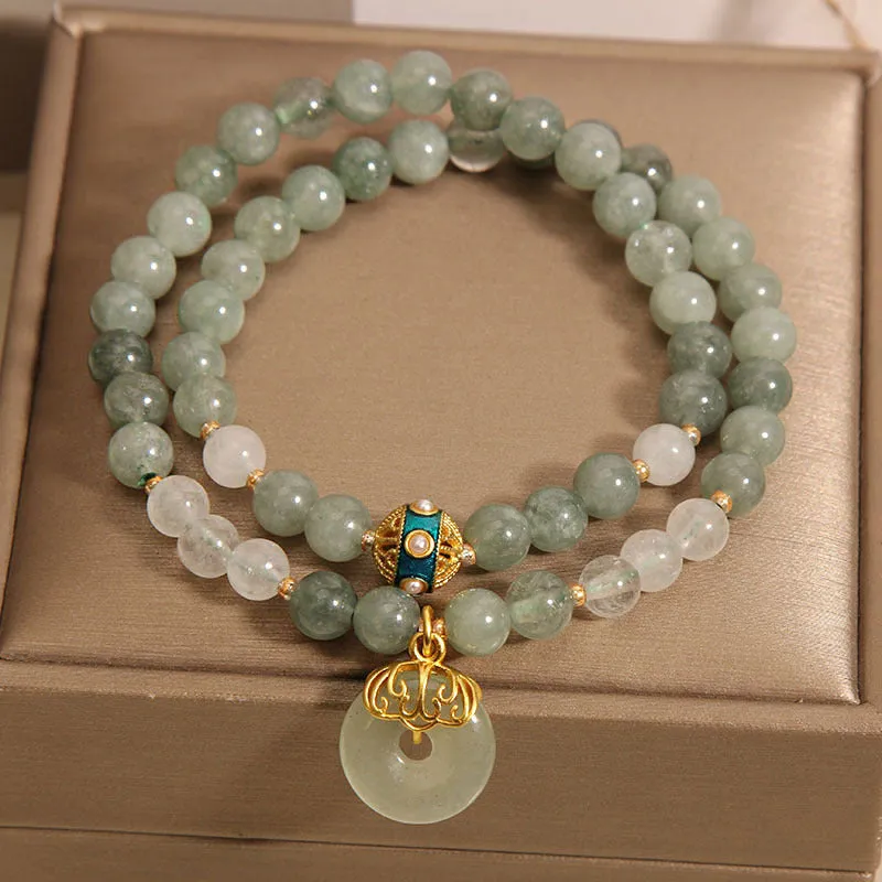 Women's double-layer crystal bracelet with peace buckle in oil emerald colour and rhinestone detailing