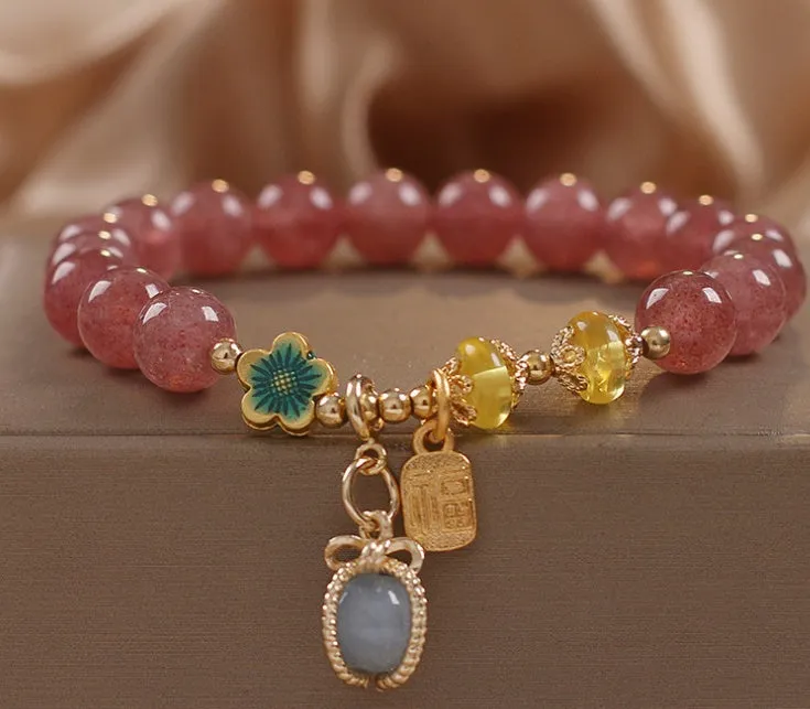 Red strawberry quartz beaded bracelet with alloy setting and rhinestone decoration