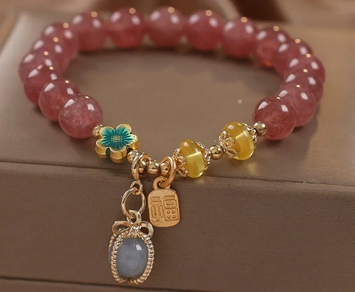 Red strawberry quartz beaded bracelet with alloy setting and rhinestone decoration
