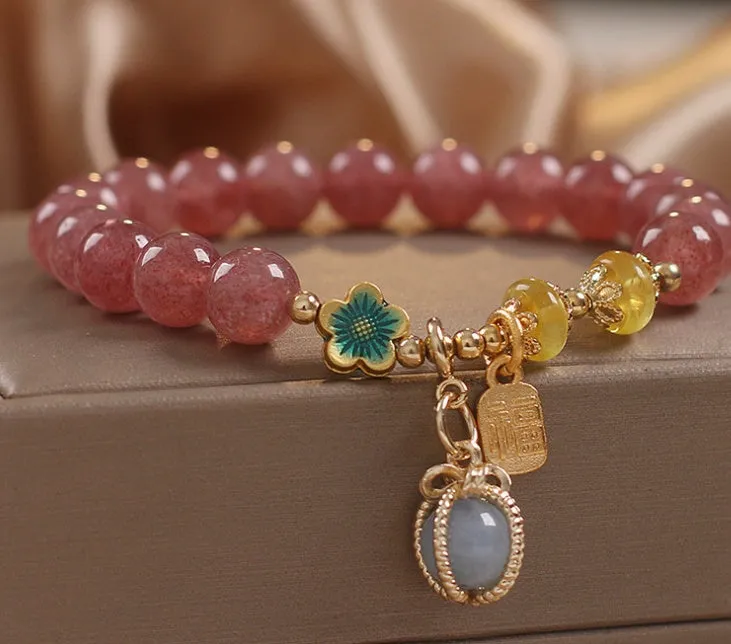Red strawberry quartz beaded bracelet with alloy setting and rhinestone decoration