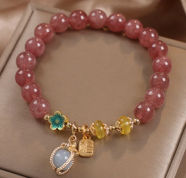 Red strawberry quartz beaded bracelet with alloy setting and rhinestone decoration