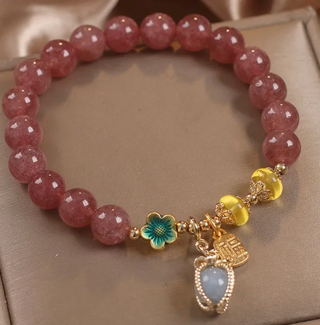 Red strawberry quartz beaded bracelet with alloy setting and rhinestone decoration