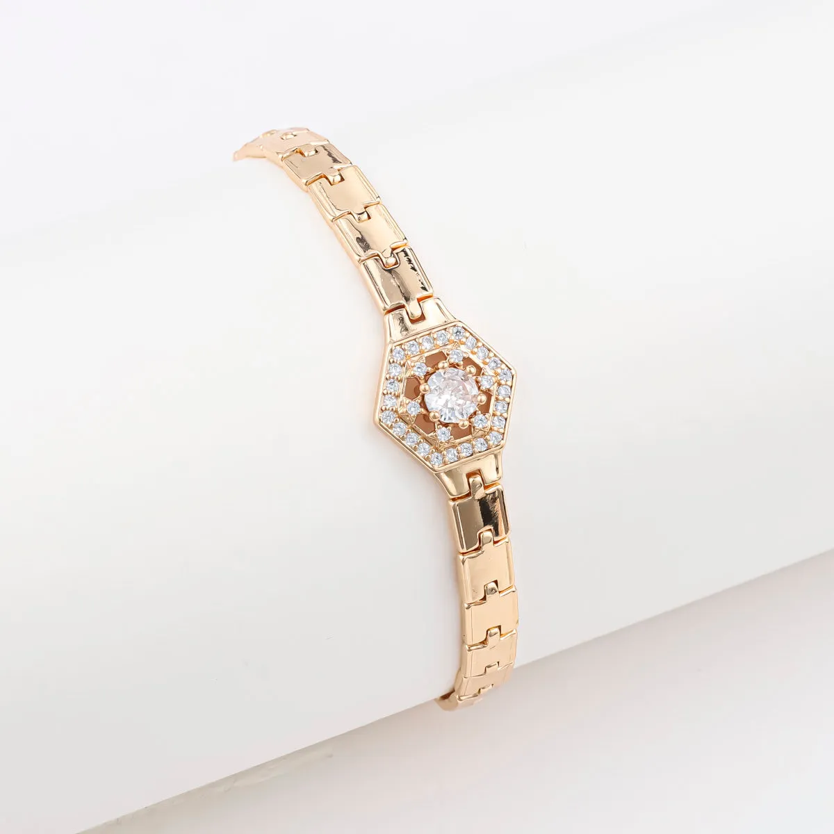 18K gold-plated butterfly clover brass bracelet with zircon stone on plain background