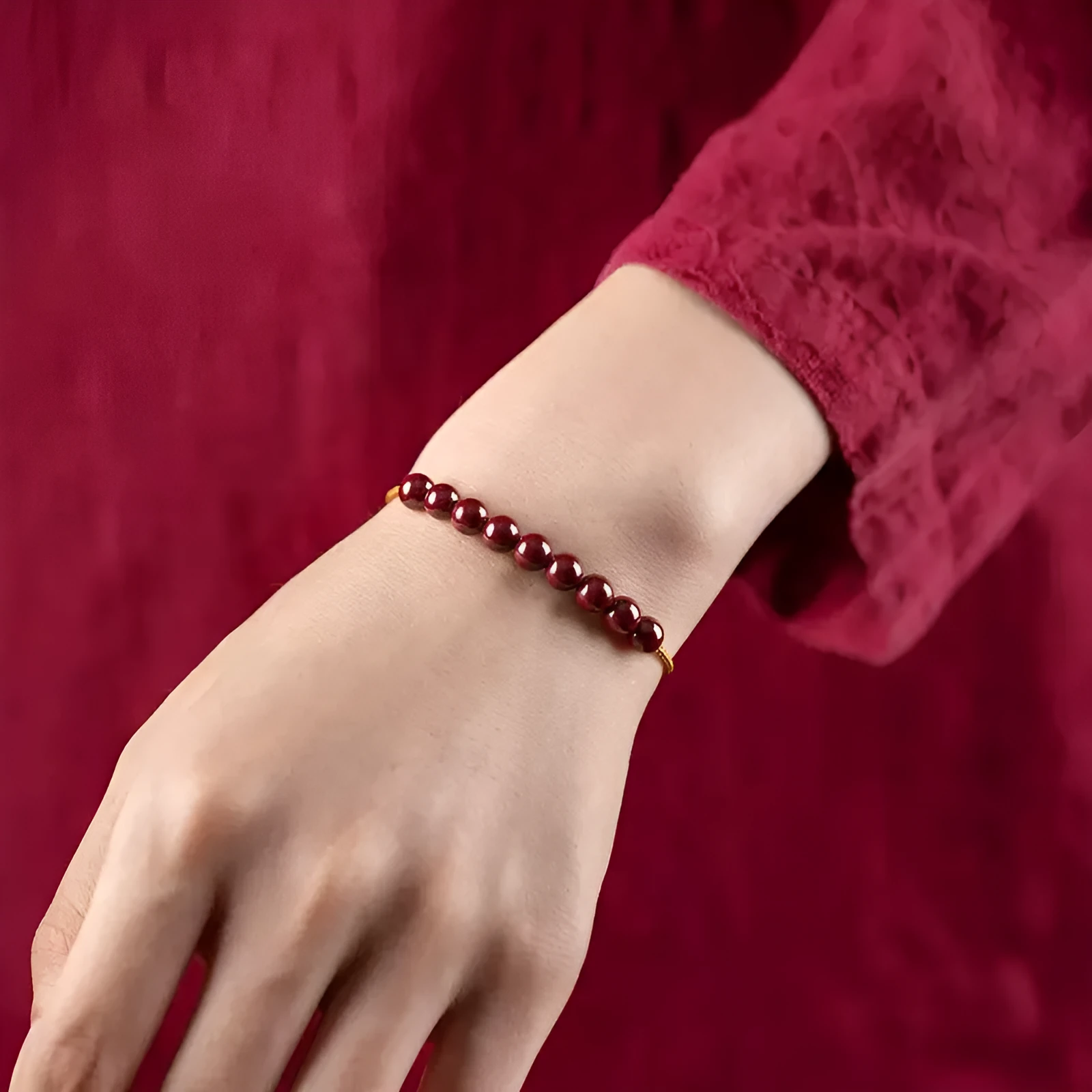 Hand-woven bracelet made from raw cinnabar and Hetian jade beads in a geometric design.