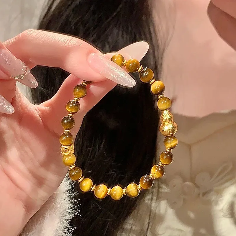Natural yellow Tiger's Eye Hetian jade bracelet with gold gourd design and U-shaped form
