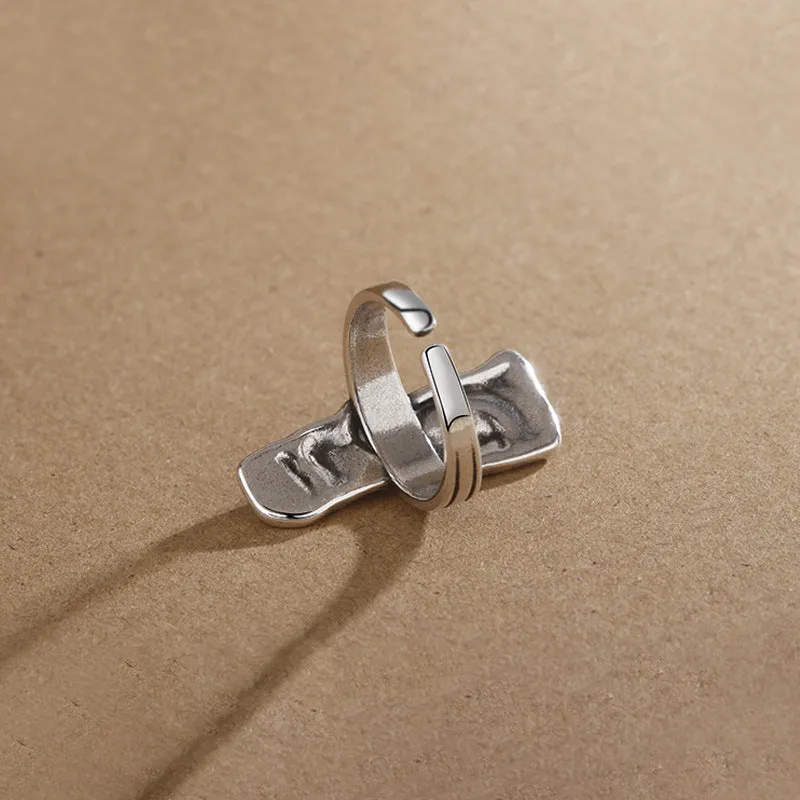 Copper retro half face mask ring with electroplated finish and adjustable opening on a neutral background.