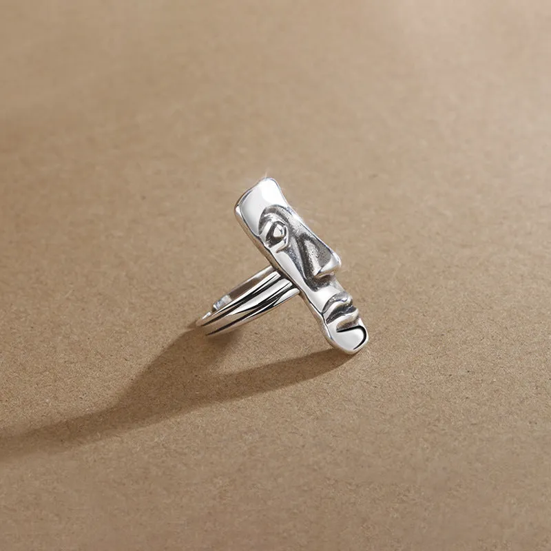 Copper retro half face mask ring with electroplated finish and adjustable opening on a neutral background.