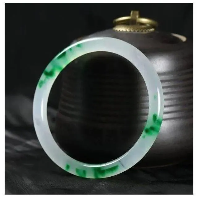 Women's jade bracelet with ice-like emerald appearance and floating flower patterns in multiple colour options
