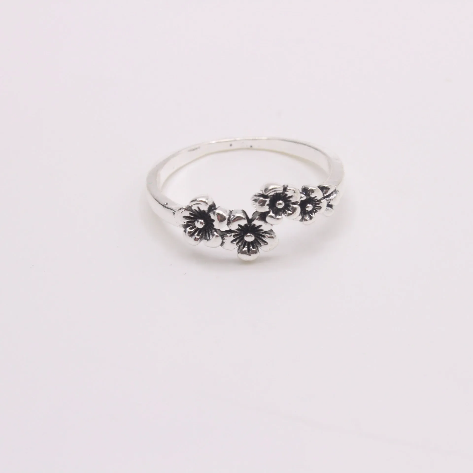 Antique silver alloy geometric ring with retro personality style on white background