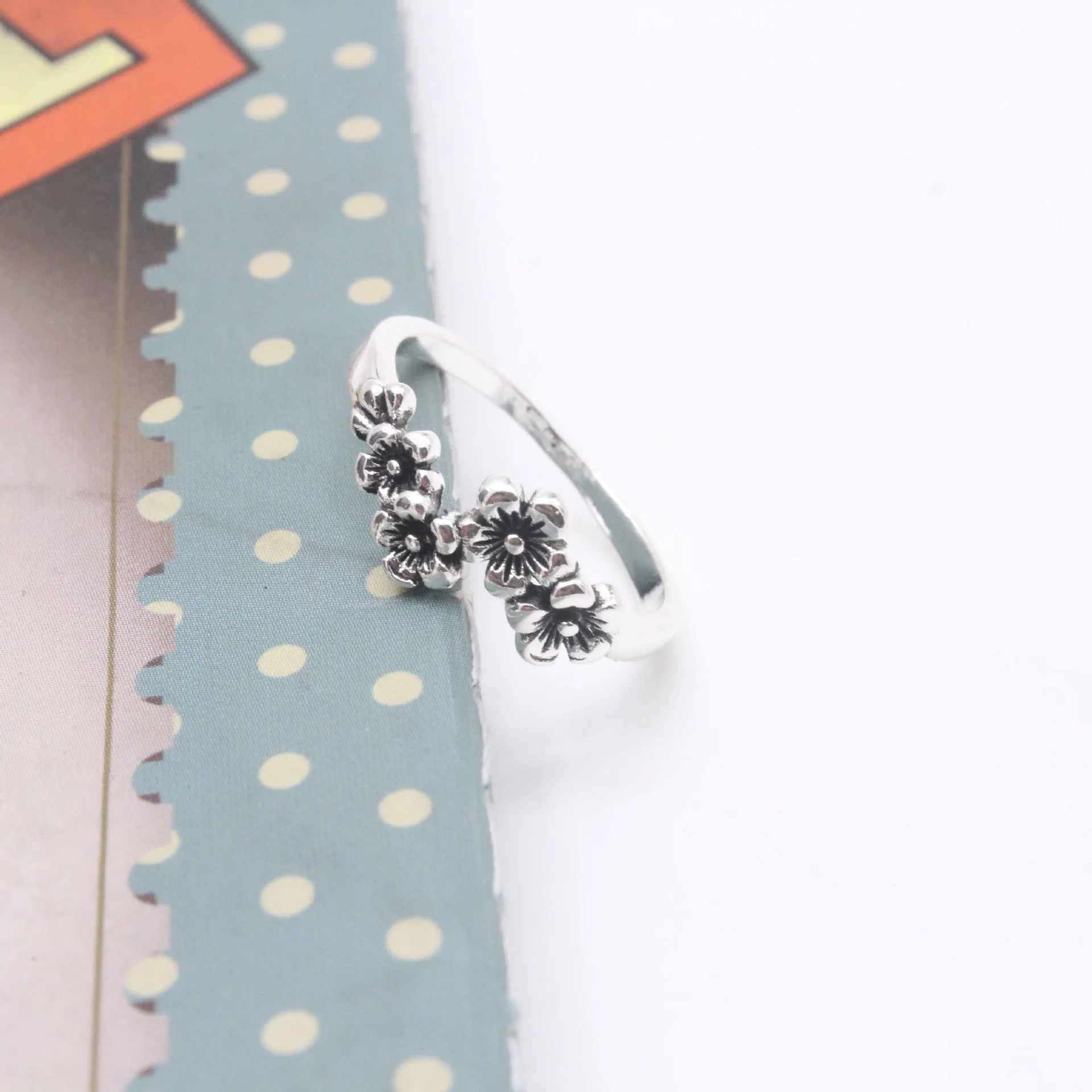 Antique silver alloy geometric ring with retro personality style on white background