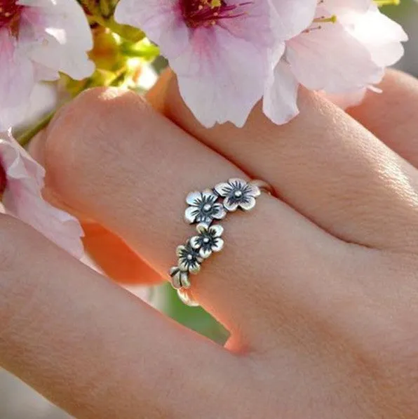 Antique silver alloy geometric ring with retro personality style on white background